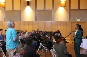 Congresswoman Simon Speaking to a Crowd at Emeryville 