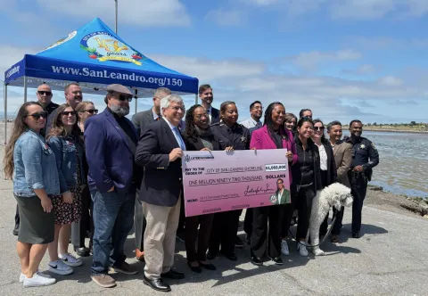 Congresswoman Simon, Mayor, and San Leandro Officials Holding a Check for San Leandro Funding 