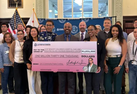 Congresswoman Simon stands with UCSF Team with Federal Funding Check