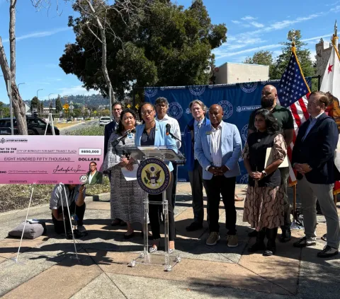 Congresswoman Simon Standing at Podium announcing funding at press conference